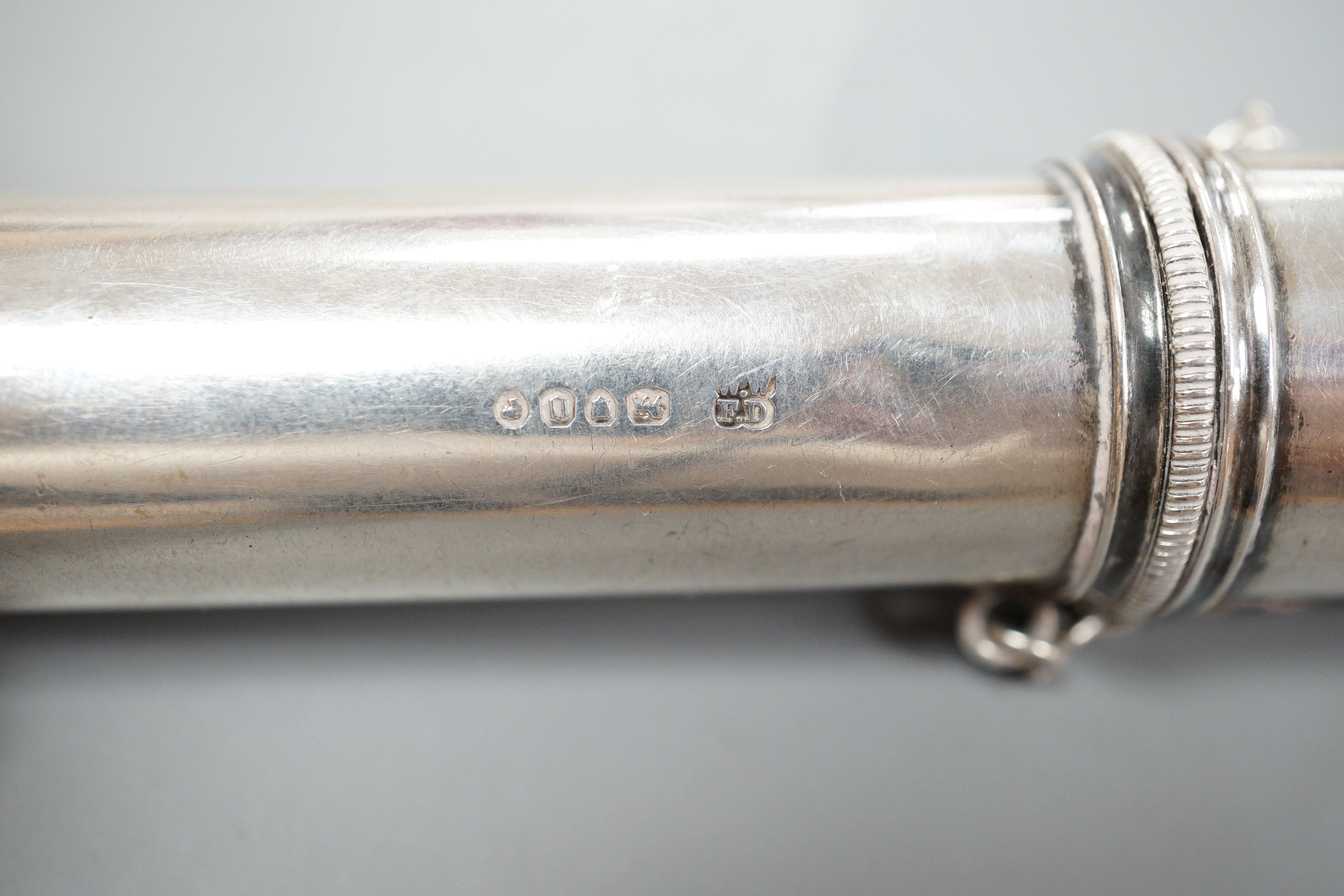 A Victorian silver cylindrical cased portable travelling candle holder with cover and spring mechanism, Wright & Davies, London, 1869, with suspension chain, 11.3cm